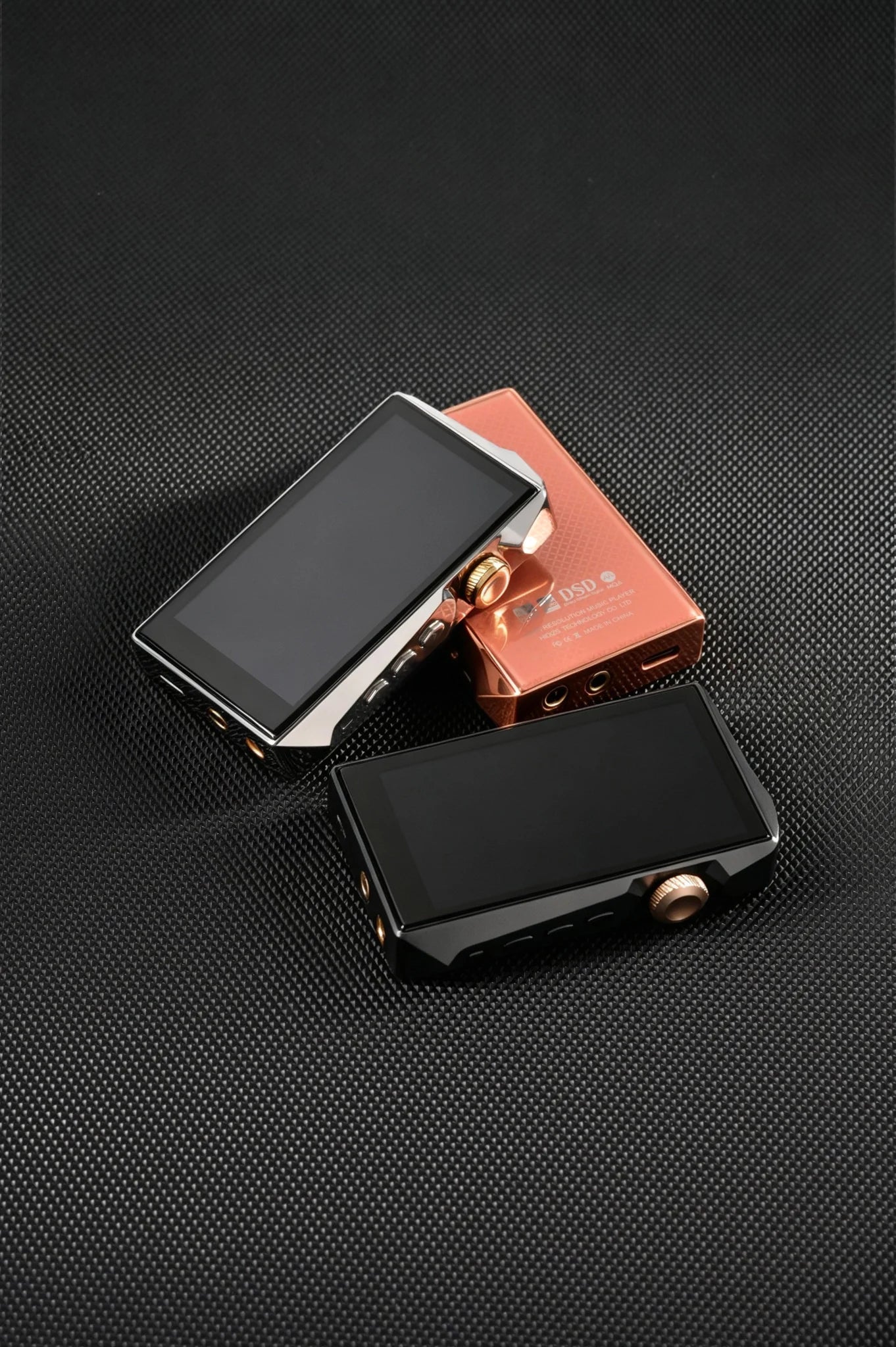 Side buttons and gold knob on rock